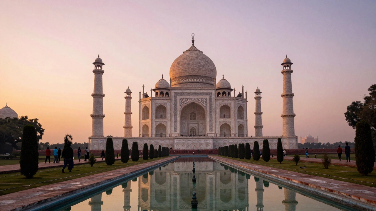 Taj Mahal reflected in water at sunrise with visitors in the gardens