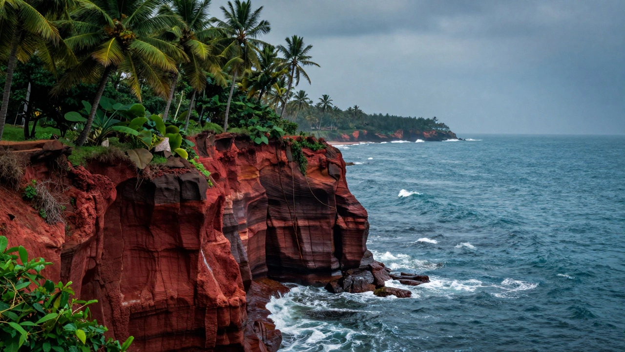 Dramatic red cliffs overlooking the blue Arabian Sea with lush palm trees in Varkala