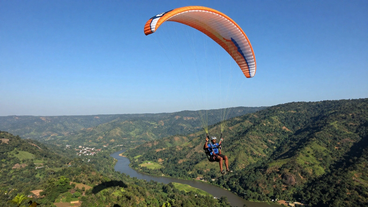 Paraglider soaring over lush Indian valley in bright sunlight