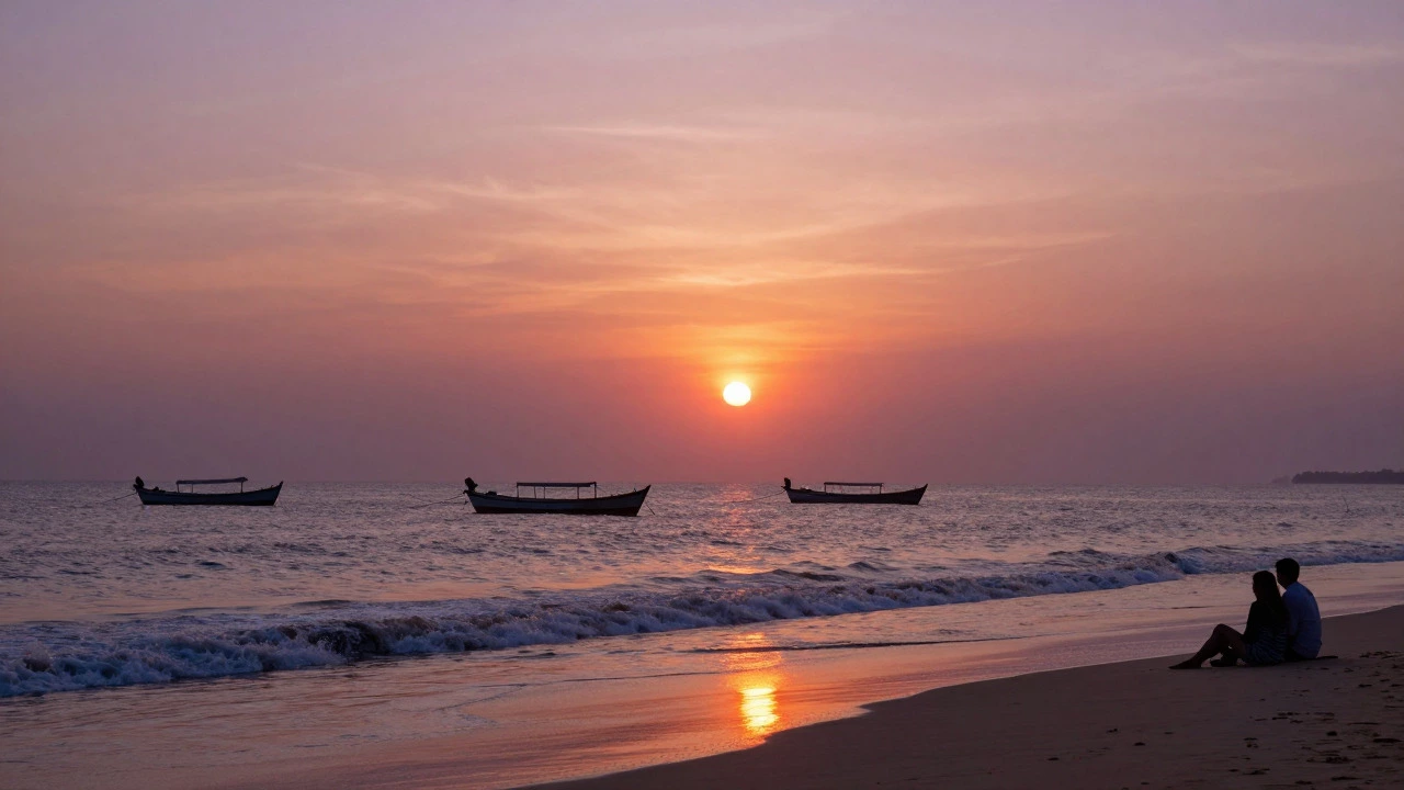 Sunset over Palolem Beach with fishing boats and colorful sky reflections
